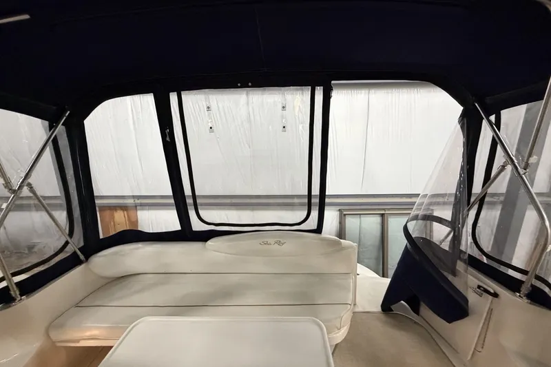 Slide: The Image of Interior view of 1999 Sea Ray 340 Sundancer with seating and windows. - 16