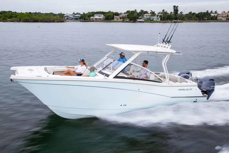 The Image of 2021 World Cat 280 DC-X cruising on water with passengers enjoying the ride. - 0