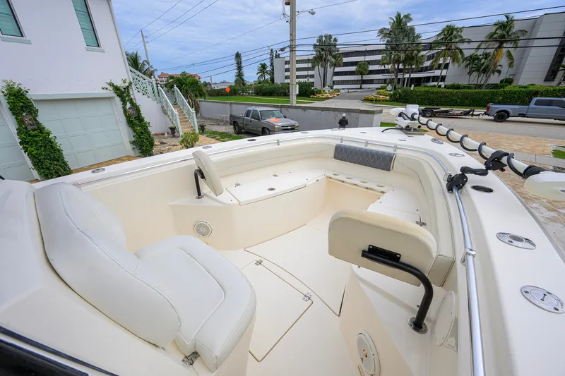 Slide: The Image of 2019 Cobia 301 Center Console boat with spacious seating and modern design. - 50