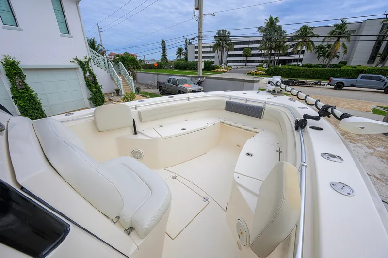 Slide: The Image of 2019 Cobia 301 Center Console boat with spacious seating and modern design. - 45