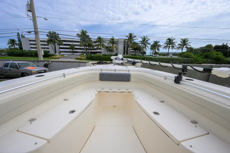 Slide: The Image of 2019 Cobia 301 Center Console boat with spacious deck and modern design. - 47