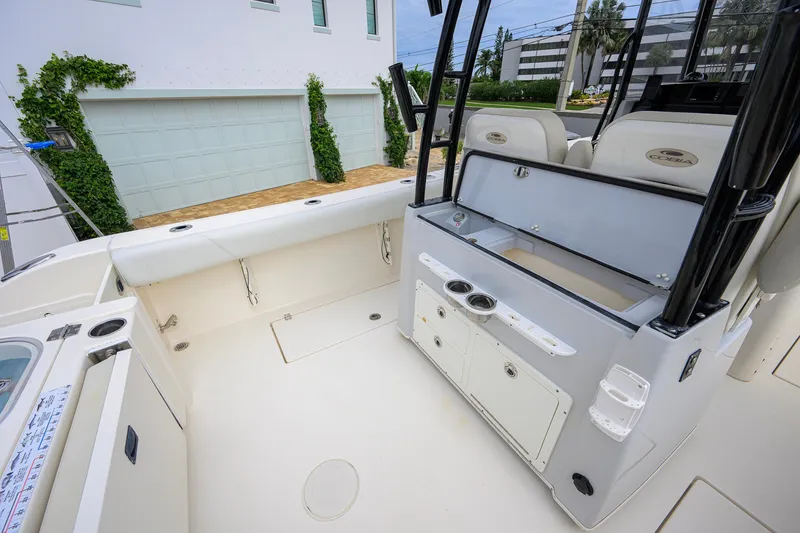 Slide: The Image of 2019 Cobia 301 Center Console boat interior with seating and storage compartments. - 19