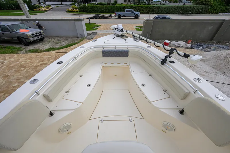 Slide: The Image of 2019 Cobia 301 Center Console boat interior with seating and storage compartments. - 46