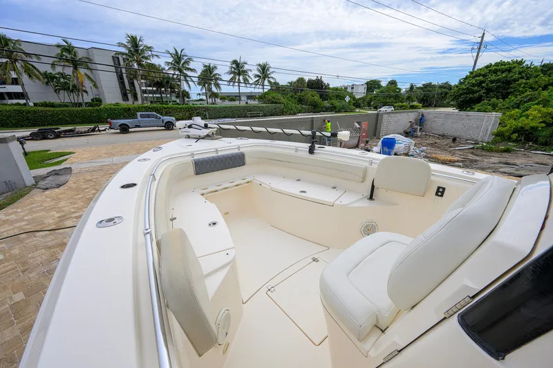 Slide: The Image of 2019 Cobia 301 Center Console boat with spacious seating and modern design. - 53