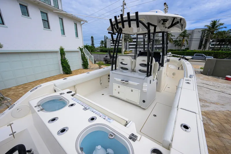 Slide: The Image of 2019 Cobia 301 Center Console boat with spacious deck and modern amenities. - 22