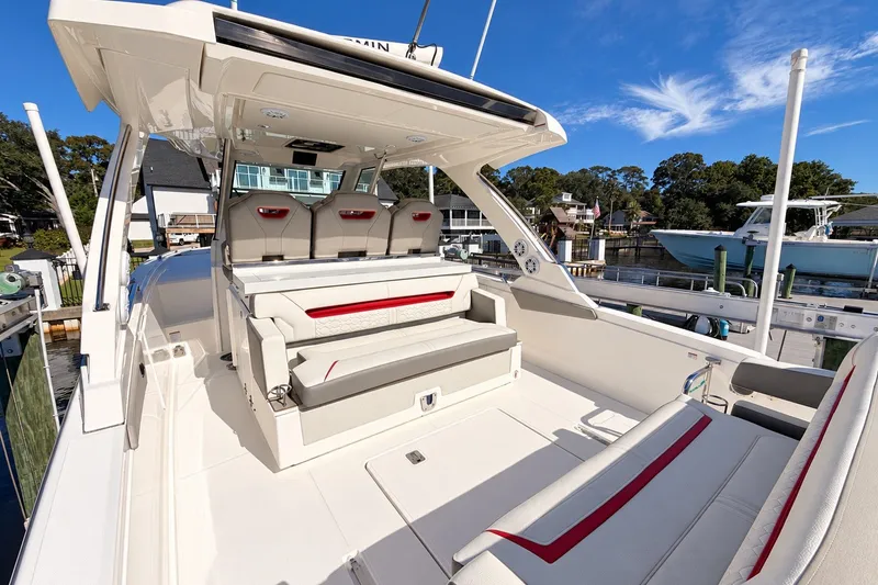 Slide: The Image of 2023 Tiara Yachts 34 LS luxury boat with spacious seating and sleek design. - 13