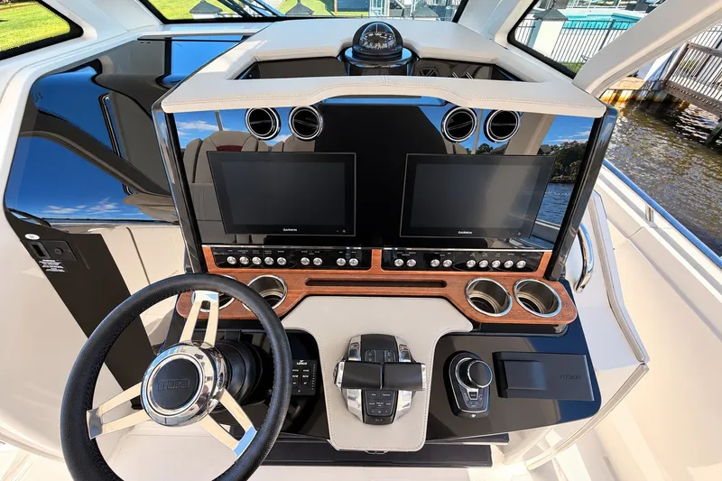 Slide: The Image of 2023 Tiara Yachts 34 LS helm with dual displays and modern controls. - 17