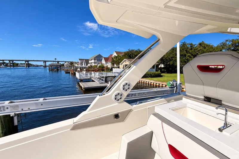 Slide: The Image of 2023 Tiara Yachts 34 LS interior with waterfront view, showcasing luxury design and amenities. - 16