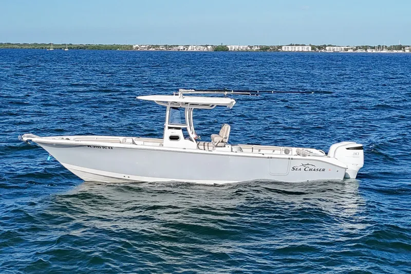The Image of 2021 Sea Chaser 30 HFC CC boat on open water, clear sky background. - 0