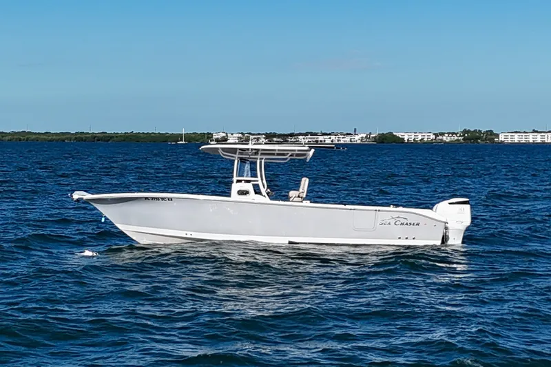Slide: The Image of 2021 Sea Chaser 30 HFC CC boat on open water under clear blue sky. - 6