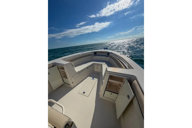 Slide: The Image of 2021 Sea Chaser 30 HFC CC boat on open water under clear blue sky. - 8