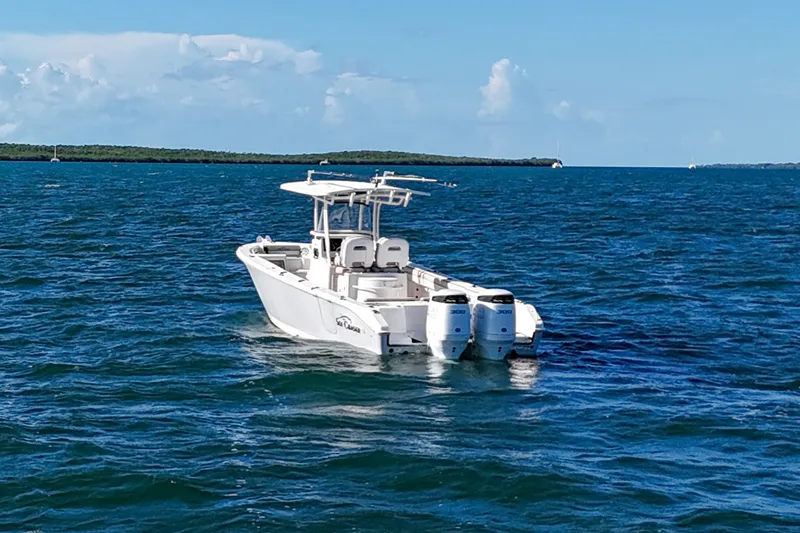 Slide: The Image of 2021 Sea Chaser 30 HFC CC boat on open water under clear blue sky. - 1