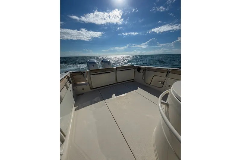 Slide: The Image of 2021 Sea Chaser 30 HFC CC boat deck with ocean view under sunny sky. - 9