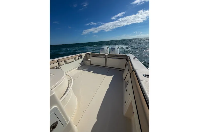 Slide: The Image of 2021 Sea Chaser 30 HFC CC boat on open water under clear blue sky. - 10