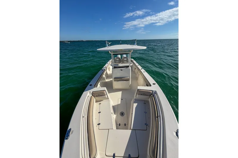 Slide: The Image of 2021 Sea Chaser 30 HFC CC boat on open water under clear blue sky. - 17