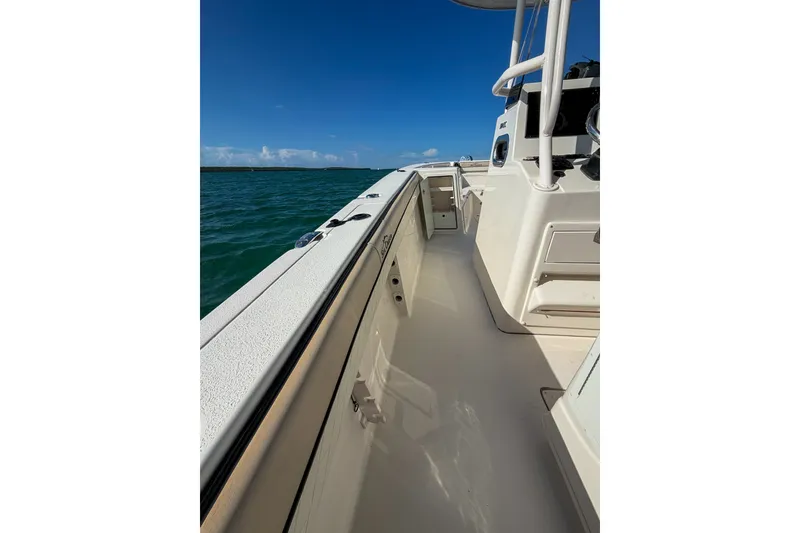 Slide: The Image of 2021 Sea Chaser 30 HFC CC boat deck with ocean view under clear blue sky. - 13