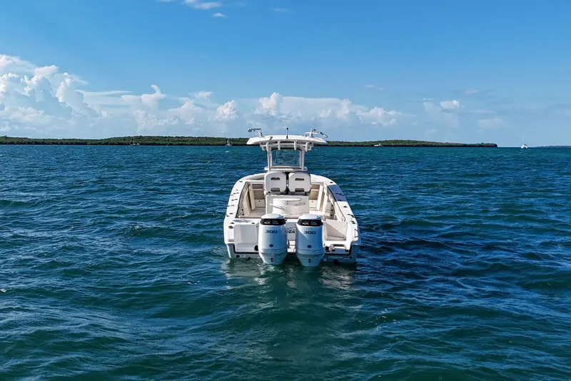 Slide: The Image of 2021 Sea Chaser 30 HFC CC boat on open water under clear blue sky. - 7