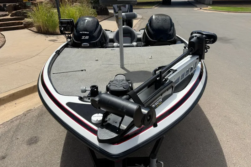 Slide: The Image of 2014 Nitro Z-6 boat with trolling motor on a sunny day. - 4