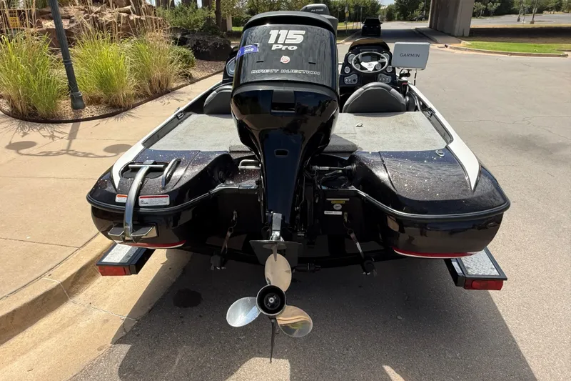 Slide: The Image of 2014 Nitro Z-6 boat with 115 Pro motor, parked on a trailer. - 8