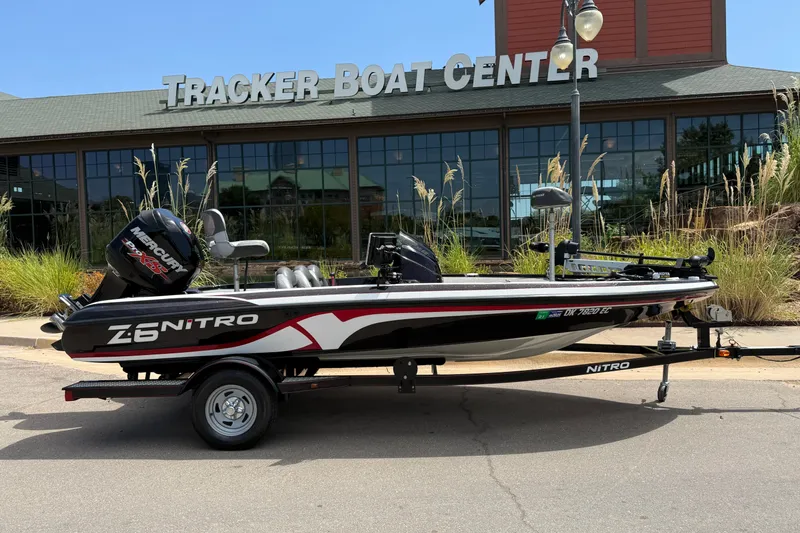 Slide: The Image of 2014 Nitro Z-6 boat parked outside Tracker Boat Center. - 1