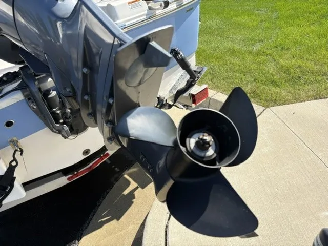 Slide: The Image of Close-up of a boat propeller on a 2023 Robalo R207 Dual Console, on a trailer. - 19