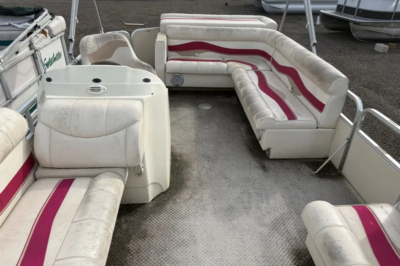 Slide: The Image of Interior of a 2008 Sweetwater Tuscany 1880 pontoon boat with white and pink seating. - 4