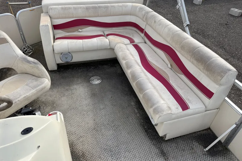 Slide: The Image of Interior of a 2008 Sweetwater Tuscany 1880 boat with white and red seating. - 6