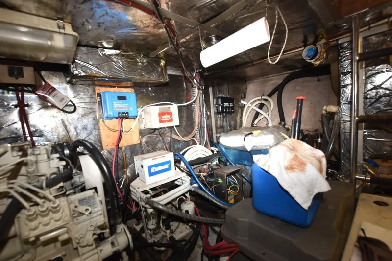 Slide: The Image of Engine room of 1989 Jefferson Marquessa 52 Extended Deckhouse with various equipment and wiring. - 41