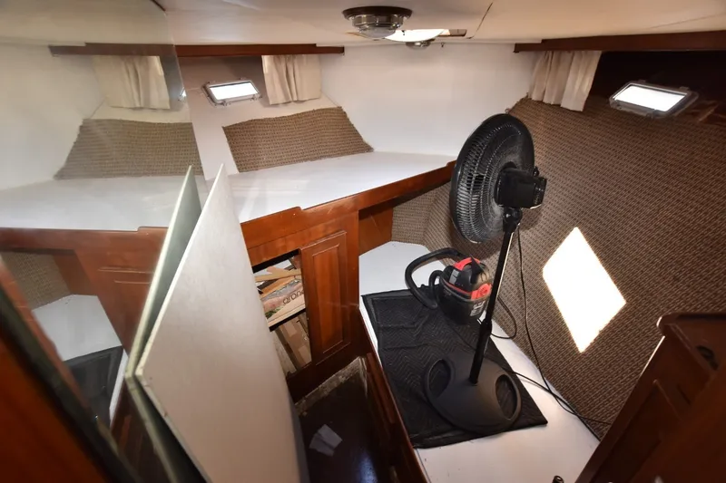 Slide: The Image of Interior cabin of 1989 Jefferson Marquessa 52 yacht with fan and storage space. - 17