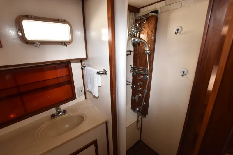 Slide: The Image of Bathroom interior of 1989 Jefferson Marquessa 52 yacht with shower and sink. - 15