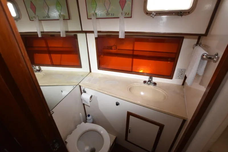 Slide: The Image of Bathroom interior of 1989 Jefferson Marquessa 52 yacht with sink and toilet. - 16