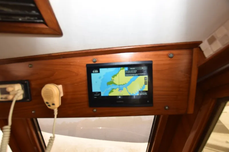 Slide: The Image of Navigation screen and radio on 1989 Jefferson Marquessa 52 Extended Deckhouse yacht. - 20
