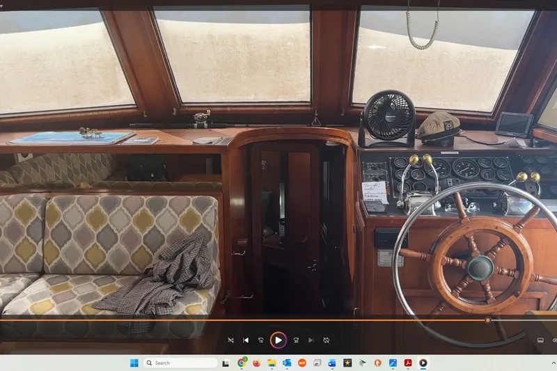 Slide: The Image of Interior of 1989 Jefferson Marquessa 52 yacht with helm, seating, and navigation instruments. - 19