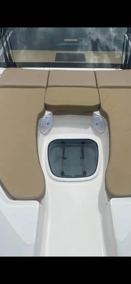 Slide: The Image of 2017 Sea Ray Sundancer 350 Coupe deck with tan cushions and hatch. - 18