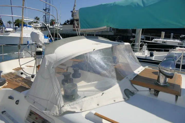Slide: The Image of 1984 Wauqueize Hood 38 MK II sailboat with covered cockpit in marina setting. - 41