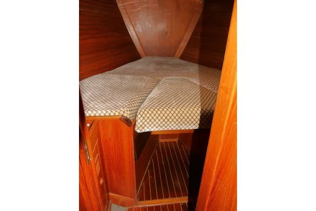 Slide: The Image of Cozy cabin interior of 1984 Wauqueize Hood 38 MK II sailboat with wooden finish. - 26
