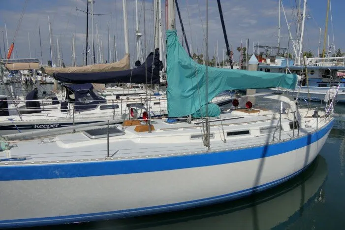 Slide: The Image of 1984 Wauqueize Hood 38 MK II sailboat docked in a marina. - 50