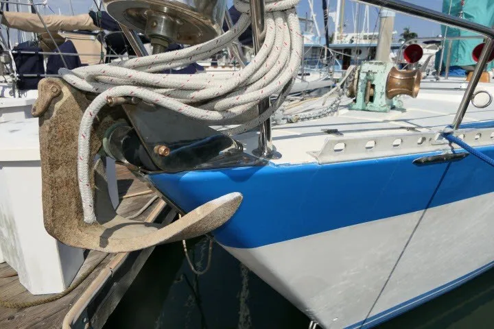 Slide: The Image of 1984 Wauqueize Hood 38 MK II sailboat with anchor and ropes at marina. - 48