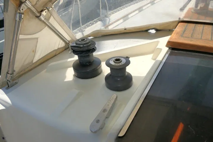 Slide: The Image of Winches on 1984 Wauqueize Hood 38 MK II sailboat deck, with sunlight and shadows. - 39