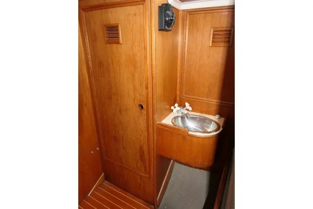 Slide: The Image of Wooden interior of 1984 Wauqueize Hood 38 MK II with sink and cabinet. - 25