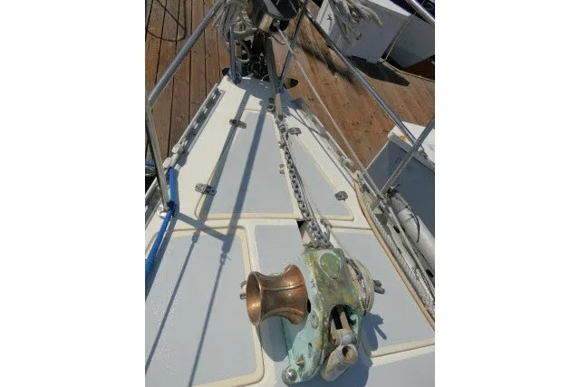 Slide: The Image of Bow of 1984 Wauqueize Hood 38 MK II sailboat with anchor chain and windlass. - 45
