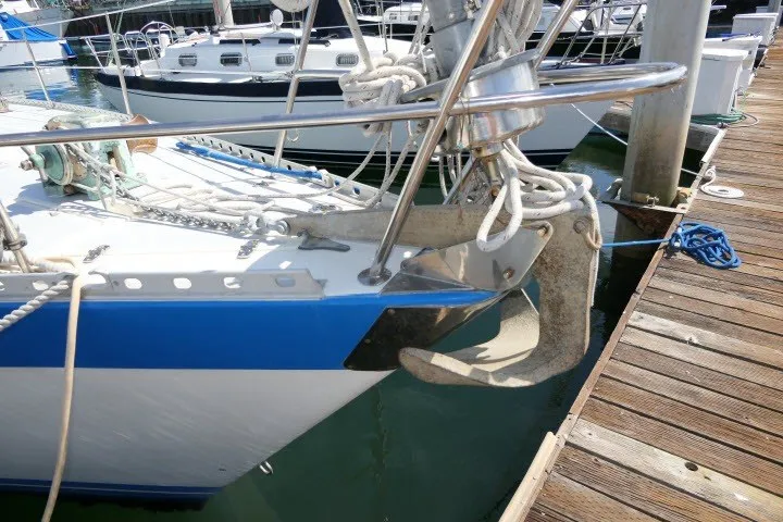 Slide: The Image of 1984 Wauqueize Hood 38 MK II sailboat anchored at a marina dock. - 46