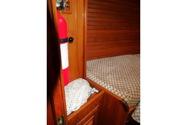 Slide: The Image of Interior of 1984 Wauqueize Hood 38 MK II with fire extinguisher and bed. - 27