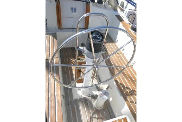 Slide: The Image of Steering wheel of 1984 Wauqueize Hood 38 MK II sailboat with wooden deck. - 33