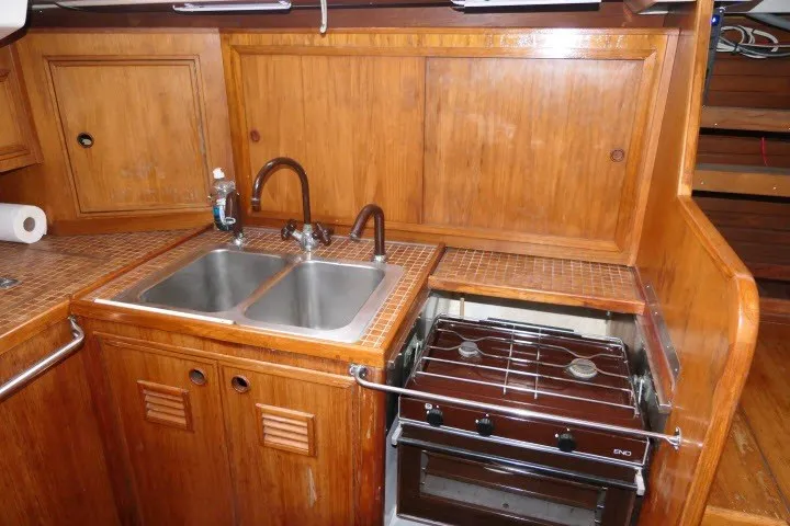 Slide: The Image of 1984 Wauqueize Hood 38 MK II yacht kitchen with dual sink and stove. - 20