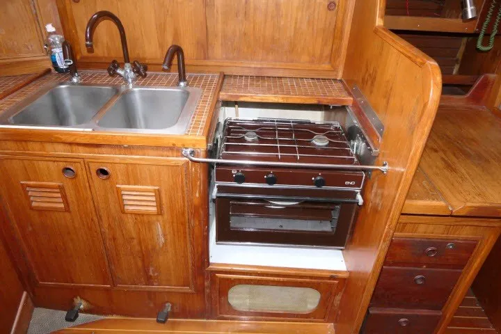 Slide: The Image of Wooden yacht kitchen with dual sink and stove, Wauqueize Hood 38 MK II, 1984 model. - 22