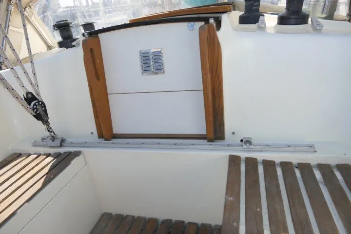 Slide: The Image of Cockpit of 1984 Wauqueize Hood 38 MK II sailboat with wooden accents. - 38