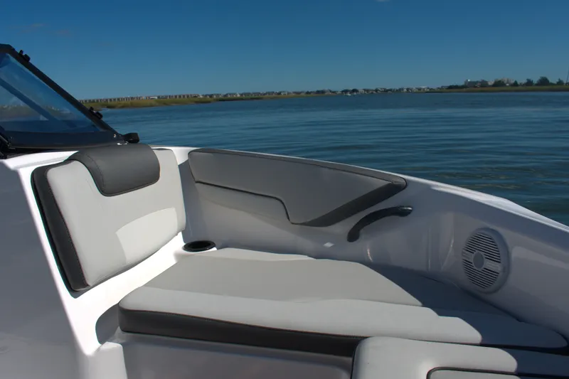 Slide: The Image of 2025 Yamaha Boats AR190 interior seating with scenic water view. - 6