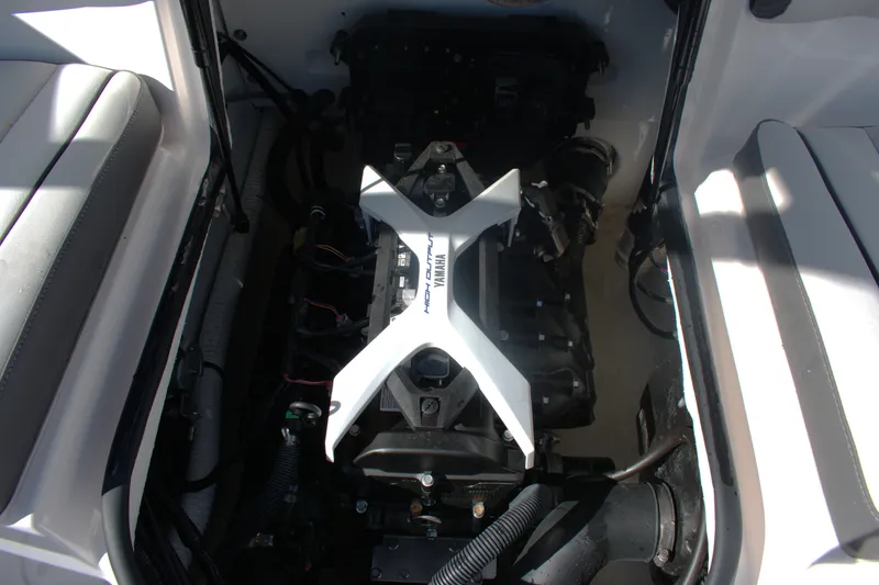 Slide: The Image of Engine compartment of 2025 Yamaha Boats AR190, showcasing high-output motor components. - 18
