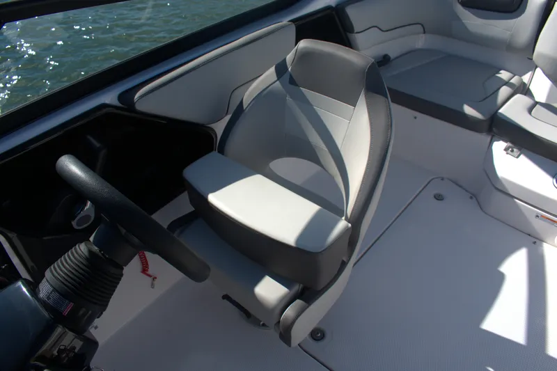 Slide: The Image of 2025 Yamaha Boats AR190 interior with steering wheel and seating. - 16